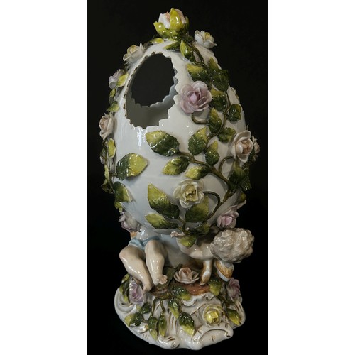 166 - Meissen style porcelain egg decorated with cherubs and roses etc.