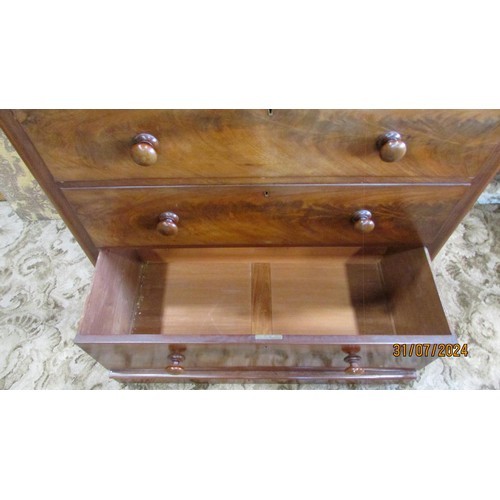 1318 - A late 19th century mahogany chest of two short and three graduating long drawers, with turned handl... 