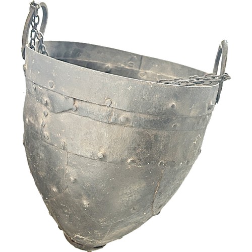 554 - A helmet shaped well bucket with riveted panels, 27cm diameter