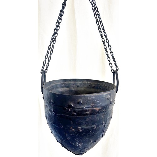 554 - A helmet shaped well bucket with riveted panels, 27cm diameter