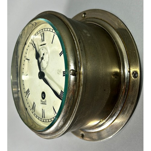 408 - A Mercer bulk head clock with polished chrome case, 6” dial.