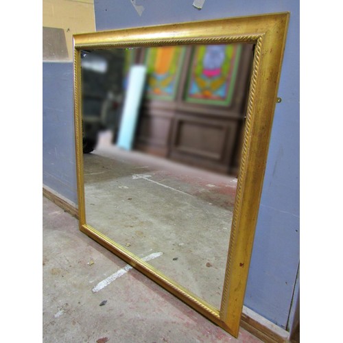 1593 - A large gilt framed wall mirror with rope twist borders, 140 x 140cm.