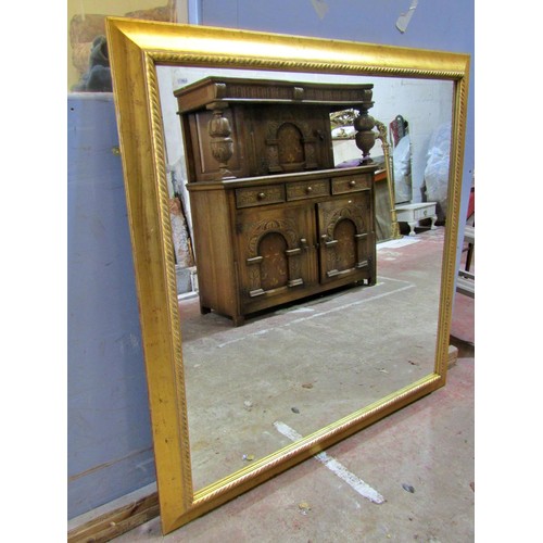 1593 - A large gilt framed wall mirror with rope twist borders, 140 x 140cm.