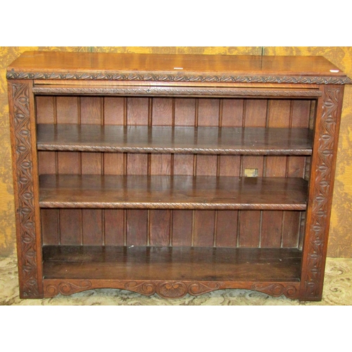 1210 - A 19th carved oak open bookcase with two adjustable shelves 122cm w x 92cm h x 39cm d.