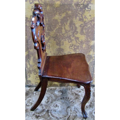 1317 - A Victorian mahogany shield back carved hall chair