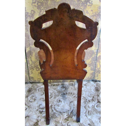 1317 - A Victorian mahogany shield back carved hall chair