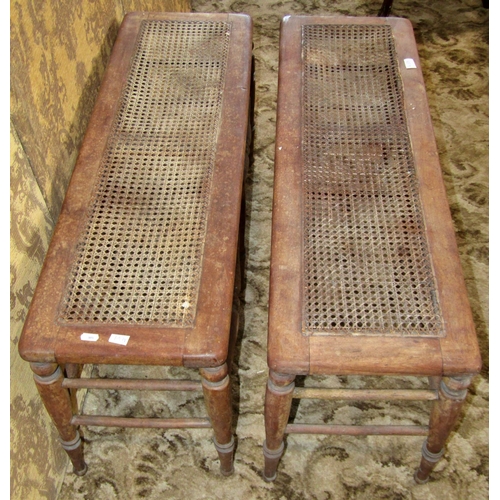 1380 - A matched pair of 19th century window benches with bergere caned seats and turned supports united by... 