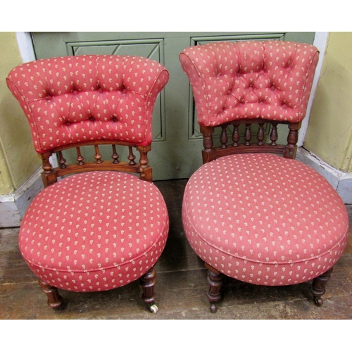 1462 - A pair of Victorian walnut drawing room chairs with spindle moulded backs on turned supports