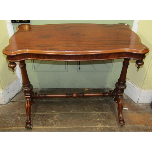 1505 - 19th century mahogany centre table, the shaped outline raised on a stretcher base with scrolled term... 