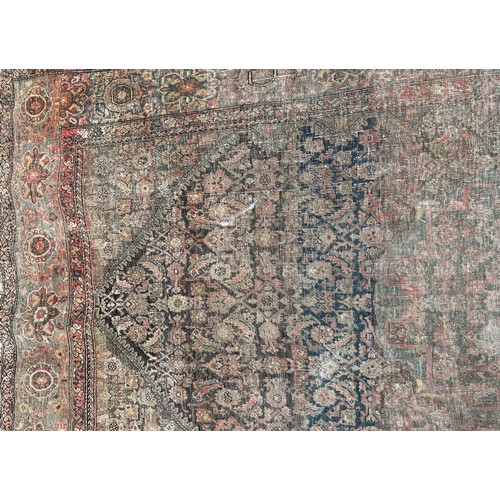 1745 - Six old worn and torn Middle Eastern carpets of varying designs, sizes and condition, all as found