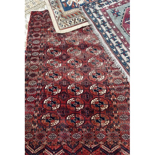 1745 - Six old worn and torn Middle Eastern carpets of varying designs, sizes and condition, all as found