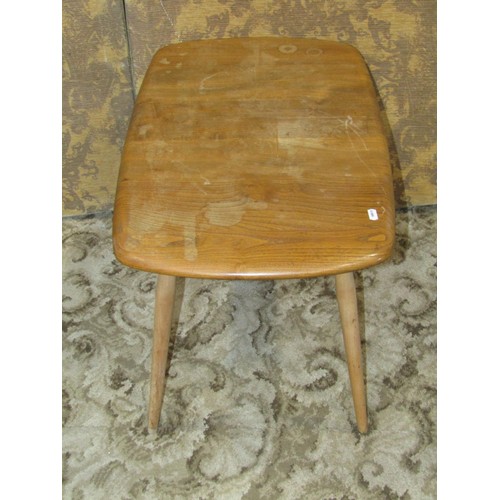 1258 - An Ercol light elm occasional table and an Edwardian oak smokers cabinet