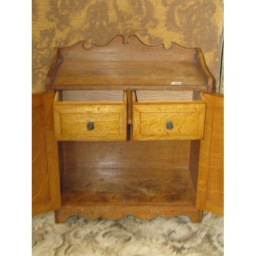 1258 - An Ercol light elm occasional table and an Edwardian oak smokers cabinet