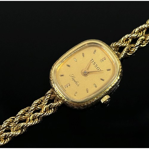 394 - Tissot: A 9ct yellow gold cased lady’s ‘Saphir’ wristwatch, on woven 9ct yellow gold strap, 11.6g (g... 