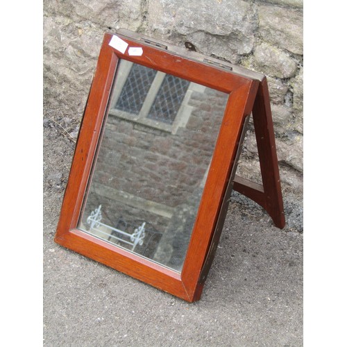 565 - A mahogany Campaign folding mirror with a ratchet support.