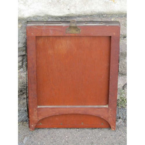 565 - A mahogany Campaign folding mirror with a ratchet support.