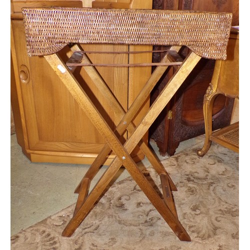 1205 - Three similar Butler’s woven cane trays / occasional tables, all with folding stands, with labels Ta... 