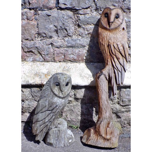 1120 - Two weathered carved wooden studies of barn owls, the largest 82cm high.