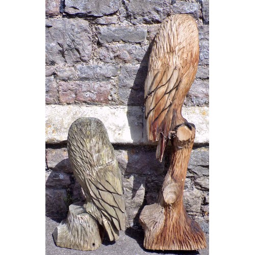 1120 - Two weathered carved wooden studies of barn owls, the largest 82cm high.