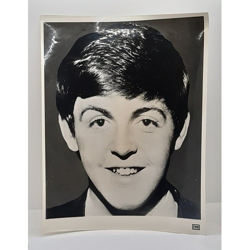 700 - Collection of four black and white photographs of The Beatles: Paul MacCartney, John Lennon, George ... 