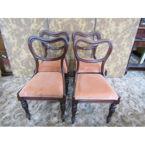 1334 - Four Victorian mahogany dining chairs with drop-in seats and turned supports.