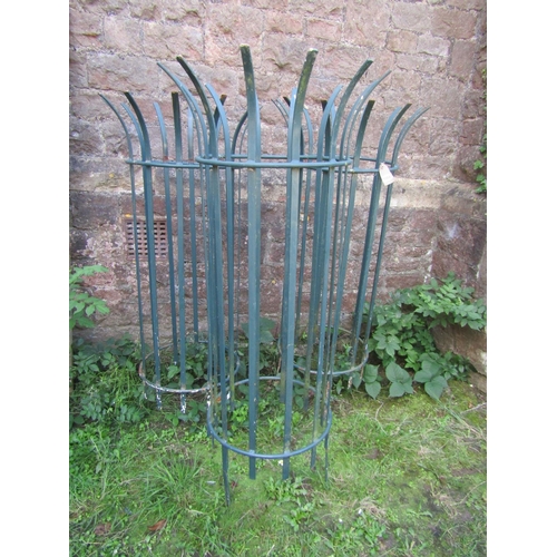 1052 - Three painted metal strapwork cylindrical crown top tree guards, 135 cm high