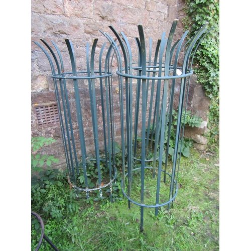 1052 - Three painted metal strapwork cylindrical crown top tree guards, 135 cm high