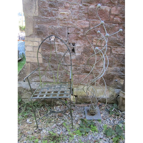 1067 - A small weathered painted patio chair with Lancet arched back and strap work seat together with a we... 