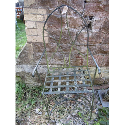 1067 - A small weathered painted patio chair with Lancet arched back and strap work seat together with a we... 