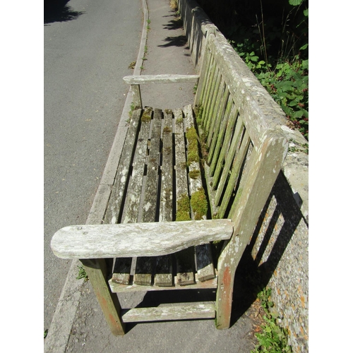 1072 - A large weathered teakwood garden bench with slatted back and seat, 95 x 163.