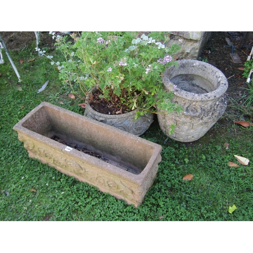 1084 - A rectangular moulded weathered composition stone garden planter, 73 x 25cm together with two circul... 