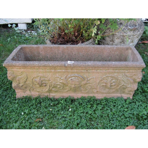 1084 - A rectangular moulded weathered composition stone garden planter, 73 x 25cm together with two circul... 