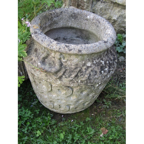 1084 - A rectangular moulded weathered composition stone garden planter, 73 x 25cm together with two circul... 