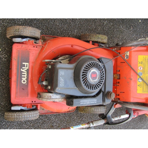 1098 - A Flymo petrol driven rotary lawn mower together with a Castor TR22CX strimmer (2)