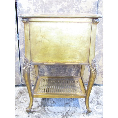 1164 - A french bedside table fitted with twin drawers and bergere caned platform base, with distressed gol... 