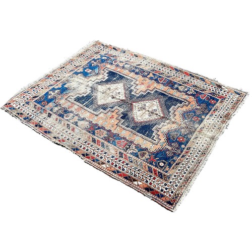 1800 - An old worn and torn Turkish rug with a central stepped panel with interconnecting diamonds 166cm x ... 