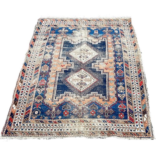 1800 - An old worn and torn Turkish rug with a central stepped panel with interconnecting diamonds 166cm x ... 