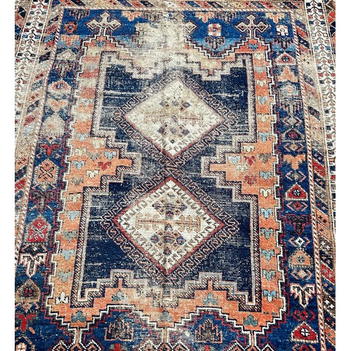 1800 - An old worn and torn Turkish rug with a central stepped panel with interconnecting diamonds 166cm x ... 