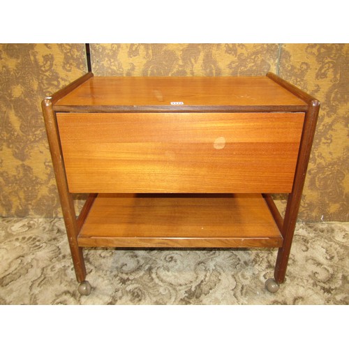 1172 - A mid 20th century teak tea trolley, a nest of occasional tables and a retro leather swivel chair (3... 