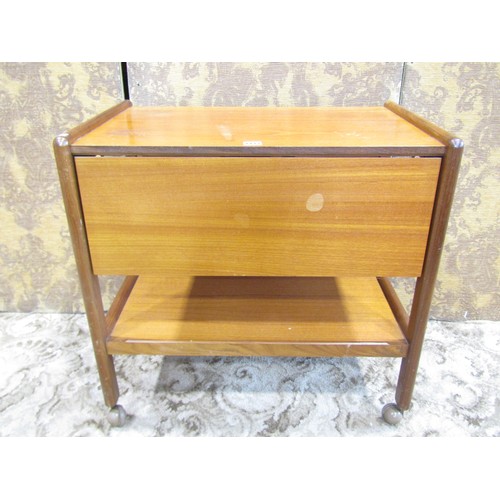 1172 - A mid 20th century teak tea trolley, a nest of occasional tables and a retro leather swivel chair (3... 