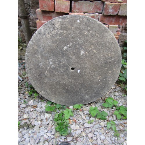 1044A - A weathered cast composition stone mill wheel, 80cm diameter