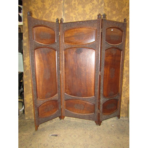 1208A - A Kashmir three fold hardwood room divider of full height with panelled frame within repeating flora... 