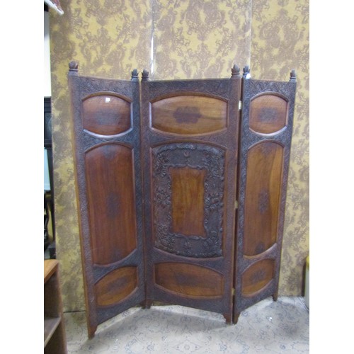 1208A - A Kashmir three fold hardwood room divider of full height with panelled frame within repeating flora... 