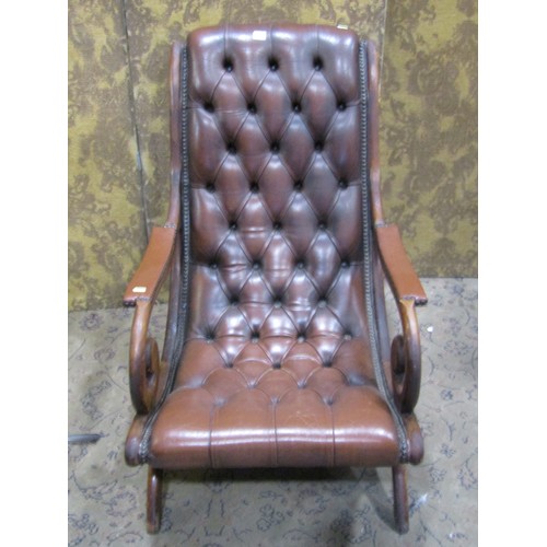 1330 - A Regency style slipper chair with button leather upholstery