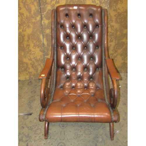 1330 - A Regency style slipper chair with button leather upholstery