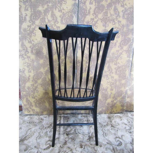 1432 - A 19th century  high backed ebonised elbow chair with cane panelled seat and interlaced back