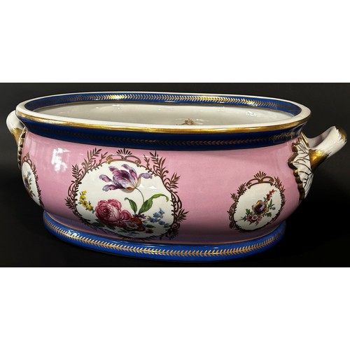 5 - A large ceramic foot bath with floral bouquet detail upon a pink ground within blue and gilt banded ... 