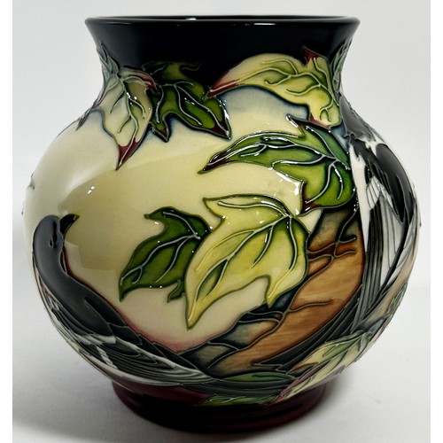 12 - A Moorcroft pottery Inglewood pattern Vase designed by Philip Gibson, decorated with birds, in origi... 