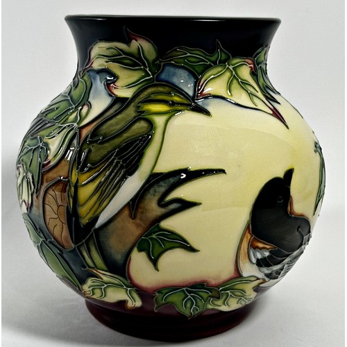 12 - A Moorcroft pottery Inglewood pattern Vase designed by Philip Gibson, decorated with birds, in origi... 