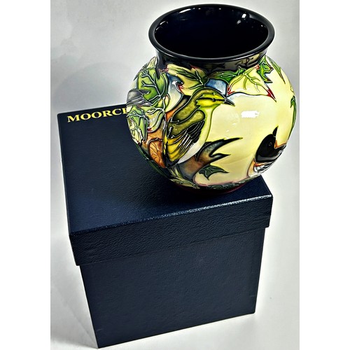 12 - A Moorcroft pottery Inglewood pattern Vase designed by Philip Gibson, decorated with birds, in origi... 